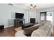 Inviting living room showcasing hardwood floors, a fireplace, and a comfortable seating area at 5044 Brooke Lauren Ln, Raleigh, NC 27616