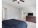 Spacious bedroom featuring neutral walls, ceiling fan, and an ensuite bathroom at 5044 Brooke Lauren Ln, Raleigh, NC 27616