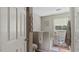 Bathroom showcasing a bathtub with decorative storage and wall decor at 5064 Murrell Dr, Oxford, NC 27565