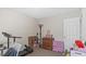 This bedroom features versatile storage and exercise equipment to maximize space and promote an active lifestyle at 5064 Murrell Dr, Oxford, NC 27565