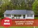 Charming single-story home featuring a metal roof, large windows, and an inviting front porch area at 5064 Murrell Dr, Oxford, NC 27565