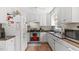 Modern kitchen with white cabinetry, stainless steel appliances, and durable countertops at 5064 Murrell Dr, Oxford, NC 27565
