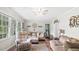 Inviting living room with hardwood floors, large windows and comfortable seating arrangements at 5064 Murrell Dr, Oxford, NC 27565