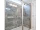 Bathroom featuring a gray tile shower with glass door at 52 E American Marigold Dr # 63, Benson, NC 27504