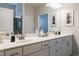 Elegant bathroom with double vanity and a large mirror at 52 E American Marigold Dr # 63, Benson, NC 27504