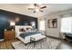 Beautiful bedroom featuring a stylish accent wall, ceiling fan, and natural light at 52 E American Marigold Dr # 63, Benson, NC 27504