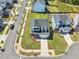 Stunning aerial view of a two-story home with lush landscaping and a driveway leading to an attached garage at 5616 Horsewalk Cir, Raleigh, NC 27606