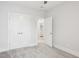 Bright bedroom with a closet and doorway leading to a laundry area at 5616 Horsewalk Cir, Raleigh, NC 27606