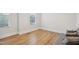Well-lit bedroom with wood floors and large windows at 5616 Horsewalk Cir, Raleigh, NC 27606