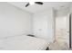 Cozy bedroom with a ceiling fan, bed, side table, closet, and entryway at 5616 Horsewalk Cir, Raleigh, NC 27606
