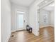 Entryway featuring light hardwood floors and a frosted glass front door at 5616 Horsewalk Cir, Raleigh, NC 27606