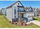 Beautiful two-story home featuring a two-car garage, stone accents, and a welcoming front porch at 5616 Horsewalk Cir, Raleigh, NC 27606