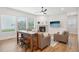 Bright living room featuring a fireplace, large windows, and wood floors at 5616 Horsewalk Cir, Raleigh, NC 27606