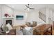 Cozy living room with fireplace, stairs, and comfortable seating at 5616 Horsewalk Cir, Raleigh, NC 27606