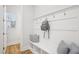 Mud room with built in bench, coat hooks, and storage at 5616 Horsewalk Cir, Raleigh, NC 27606