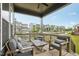 Covered patio featuring stylish outdoor seating with views of the street and neighborhood at 5616 Horsewalk Cir, Raleigh, NC 27606