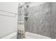 Shower with gray tiled walls, a shower curtain, and a shower head at 5616 Horsewalk Cir, Raleigh, NC 27606