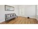 Sitting room featuring a bench, mirror, and glass doors at 5616 Horsewalk Cir, Raleigh, NC 27606