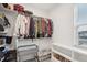Well-organized walk-in closet with shelves, rods, and overhead storage at 5616 Horsewalk Cir, Raleigh, NC 27606