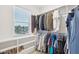 Spacious walk-in closet with built-in shelving and ample hanging space for clothes and accessories at 5616 Horsewalk Cir, Raleigh, NC 27606