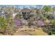 Aerial view of backyard, revealing a hot tub, patio, landscaping, and home at 595 Legacy Falls N Dr, Chapel Hill, NC 27517