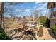 Spacious backyard featuring a hot tub, landscaping, and views of the home at 595 Legacy Falls N Dr, Chapel Hill, NC 27517