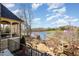 Backyard view of a lake, landscape, and outdoor seating areas at 595 Legacy Falls N Dr, Chapel Hill, NC 27517