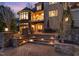 Multi-tiered stone patio featuring outdoor seating and scenic views from the elevated balcony at 595 Legacy Falls N Dr, Chapel Hill, NC 27517