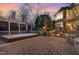 Beautifully designed patio area with a hot tub, stone pillars, and landscaped surroundings at 595 Legacy Falls N Dr, Chapel Hill, NC 27517