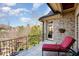 Balcony with seating area overlooking the backyard landscape at 595 Legacy Falls N Dr, Chapel Hill, NC 27517
