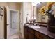 The bathroom has a vanity, granite countertop, and decorative mirror that's ideal for any home at 595 Legacy Falls N Dr, Chapel Hill, NC 27517