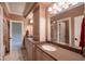 Bright bathroom features a double vanity with framed mirrors, beautiful cabinets, and tile flooring at 595 Legacy Falls N Dr, Chapel Hill, NC 27517
