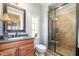 Bathroom with double sink vanity and enclosed glass shower at 595 Legacy Falls N Dr, Chapel Hill, NC 27517
