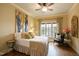 Bedroom filled with natural light offering a ceiling fan and beautiful window view at 595 Legacy Falls N Dr, Chapel Hill, NC 27517