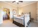 A simple secondary bedroom features an iron bed frame and ensuite bathroom at 595 Legacy Falls N Dr, Chapel Hill, NC 27517