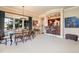 Dining area features a classic wooden table, elegant lighting, and a wet bar at 595 Legacy Falls N Dr, Chapel Hill, NC 27517
