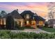 Charming home with a brick pathway leading to a beautiful front entrance with landscape at 595 Legacy Falls N Dr, Chapel Hill, NC 27517