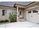 Charming brick home featuring a garage, front door and purple lilac bush at 595 Legacy Falls N Dr, Chapel Hill, NC 27517