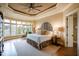 Cozy main bedroom with a trey ceiling and natural light at 595 Legacy Falls N Dr, Chapel Hill, NC 27517