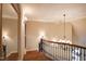 This winding staircase features wood steps and wrought iron railing at 595 Legacy Falls N Dr, Chapel Hill, NC 27517