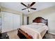 Bedroom featuring a bed, carpet flooring, a closet with sliding doors and a ceiling fan at 619 Ashburn Ln, Durham, NC 27703