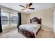 Bedroom featuring a wooden bed frame, carpet flooring and a ceiling fan at 619 Ashburn Ln, Durham, NC 27703