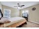 Bedroom featuring a bed, carpet flooring, and a ceiling fan at 619 Ashburn Ln, Durham, NC 27703