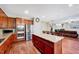 Open kitchen design with stainless steel appliances, center island, and seamless flow to the living area at 619 Ashburn Ln, Durham, NC 27703