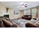 Comfortable living room with a fireplace, neutral decor, and a ceiling fan for added comfort at 619 Ashburn Ln, Durham, NC 27703