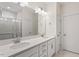 Bright bathroom features double sinks, lots of counter space and a gorgeous walk-in shower with glass door at 713 Catherine Lake Ct, Fuquay Varina, NC 27526