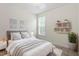 Cozy bedroom featuring a comfortable bed, soft lighting, and decorative shelves at 713 Catherine Lake Ct, Fuquay Varina, NC 27526
