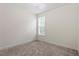 Carpeted bedroom with neutral walls and a large window at 713 Catherine Lake Ct, Fuquay Varina, NC 27526