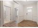 Welcoming foyer features hardwood floors, wainscoting, and a view of the front door at 713 Catherine Lake Ct, Fuquay Varina, NC 27526