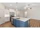 Spacious kitchen featuring an island, stainless steel appliances, and modern cabinetry at 713 Catherine Lake Ct, Fuquay Varina, NC 27526